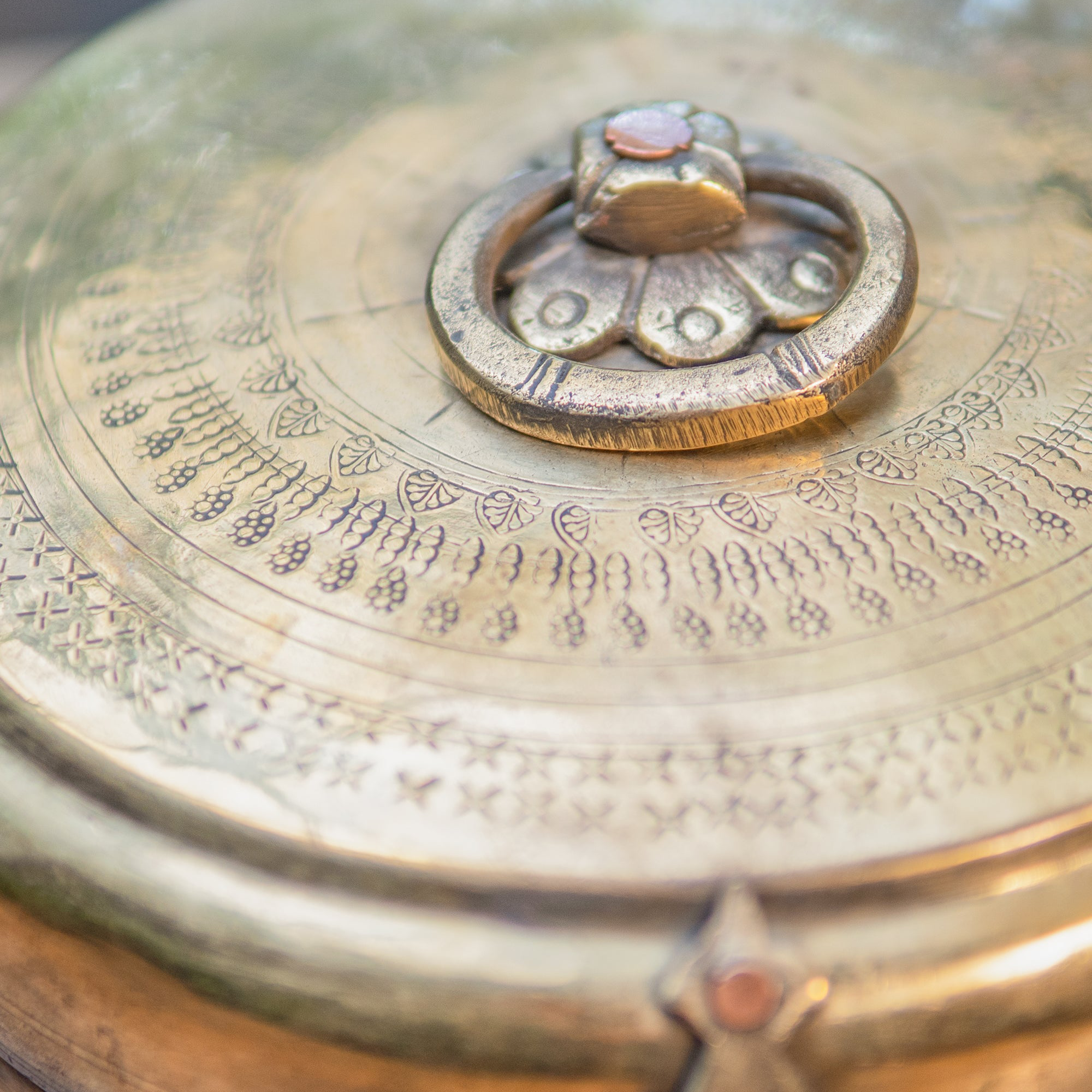 Close-up of a metallic object with 'Ambi Home' text overlay