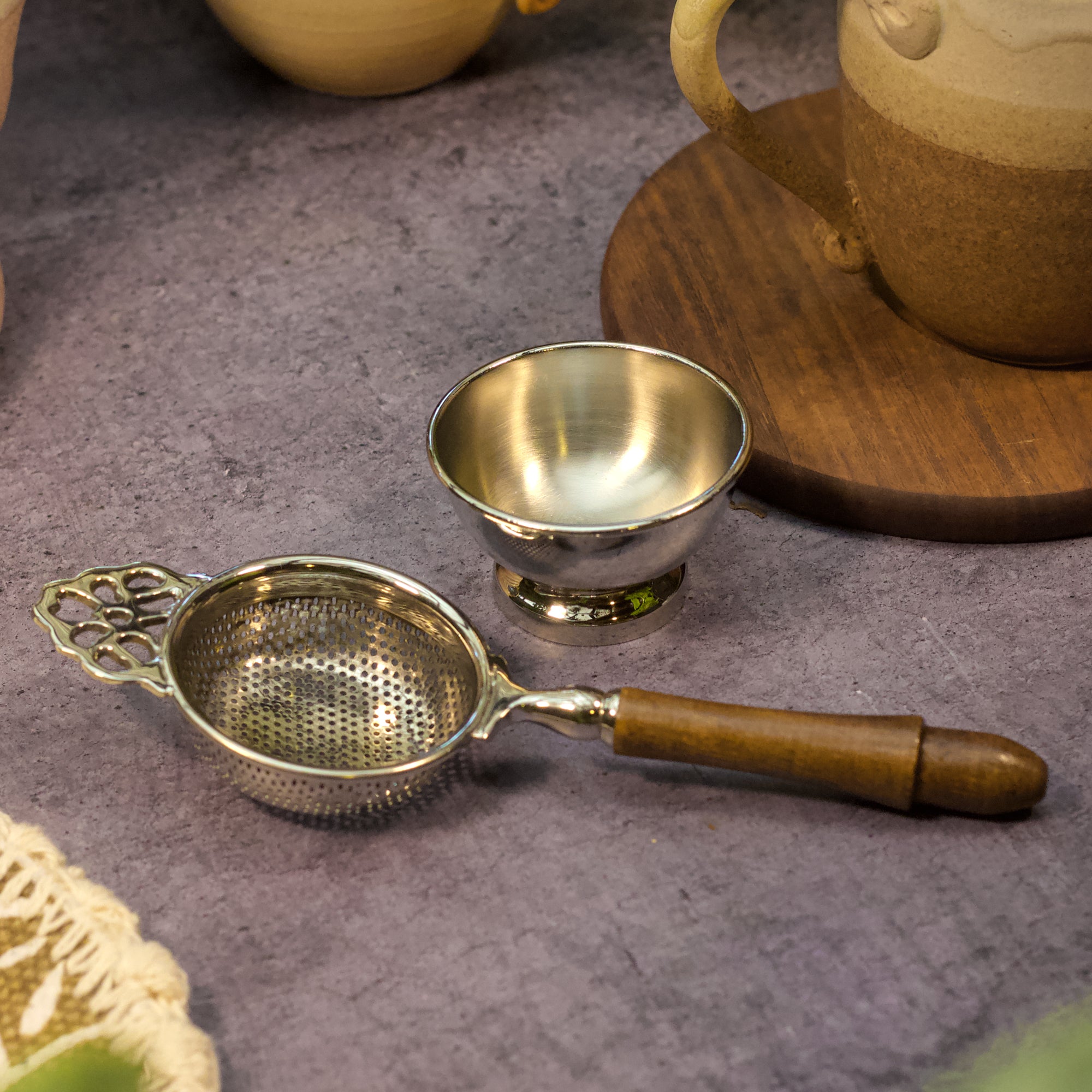 Pure Brass Punched Flower Medium Sized Tea Strainer - Gold Matte Finish With Wooden Handle and Resting pot