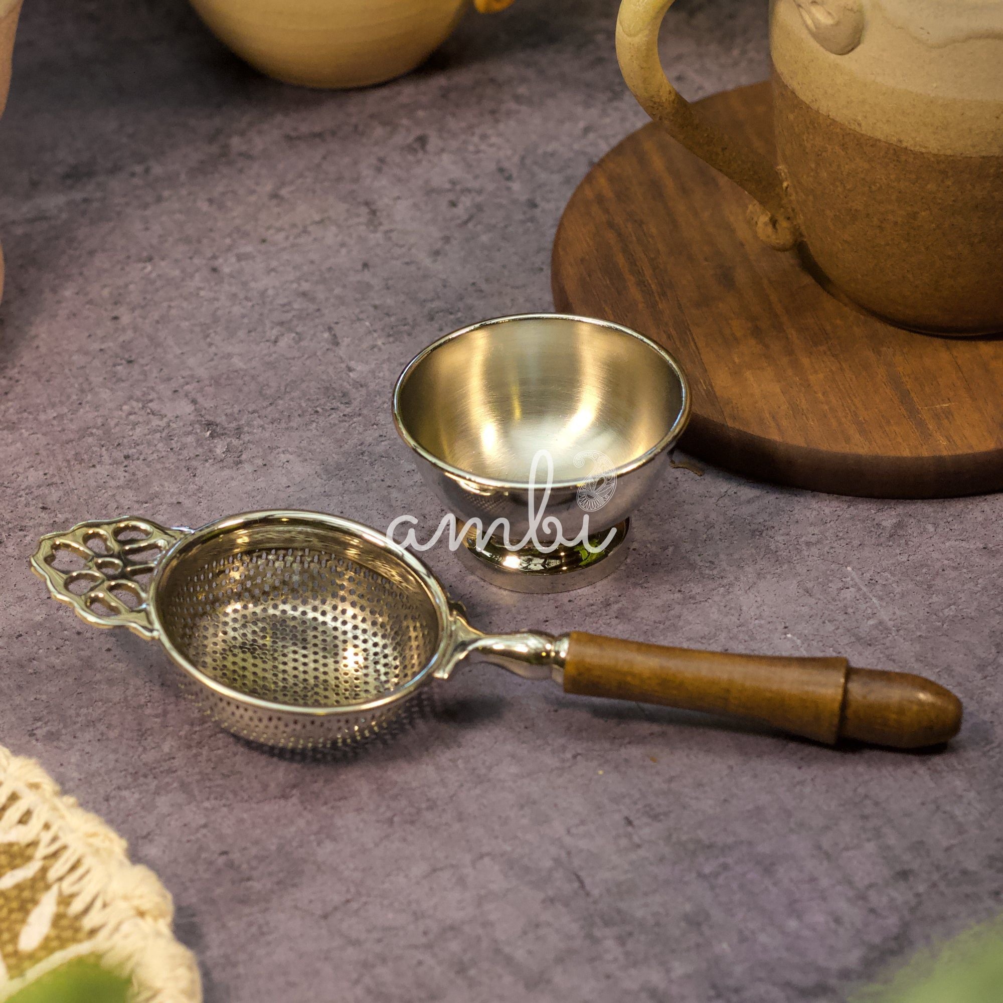 Pure Brass Punched Flower Medium Sized Tea Strainer - Gold Matte Finish With Wooden Handle and Resting pot