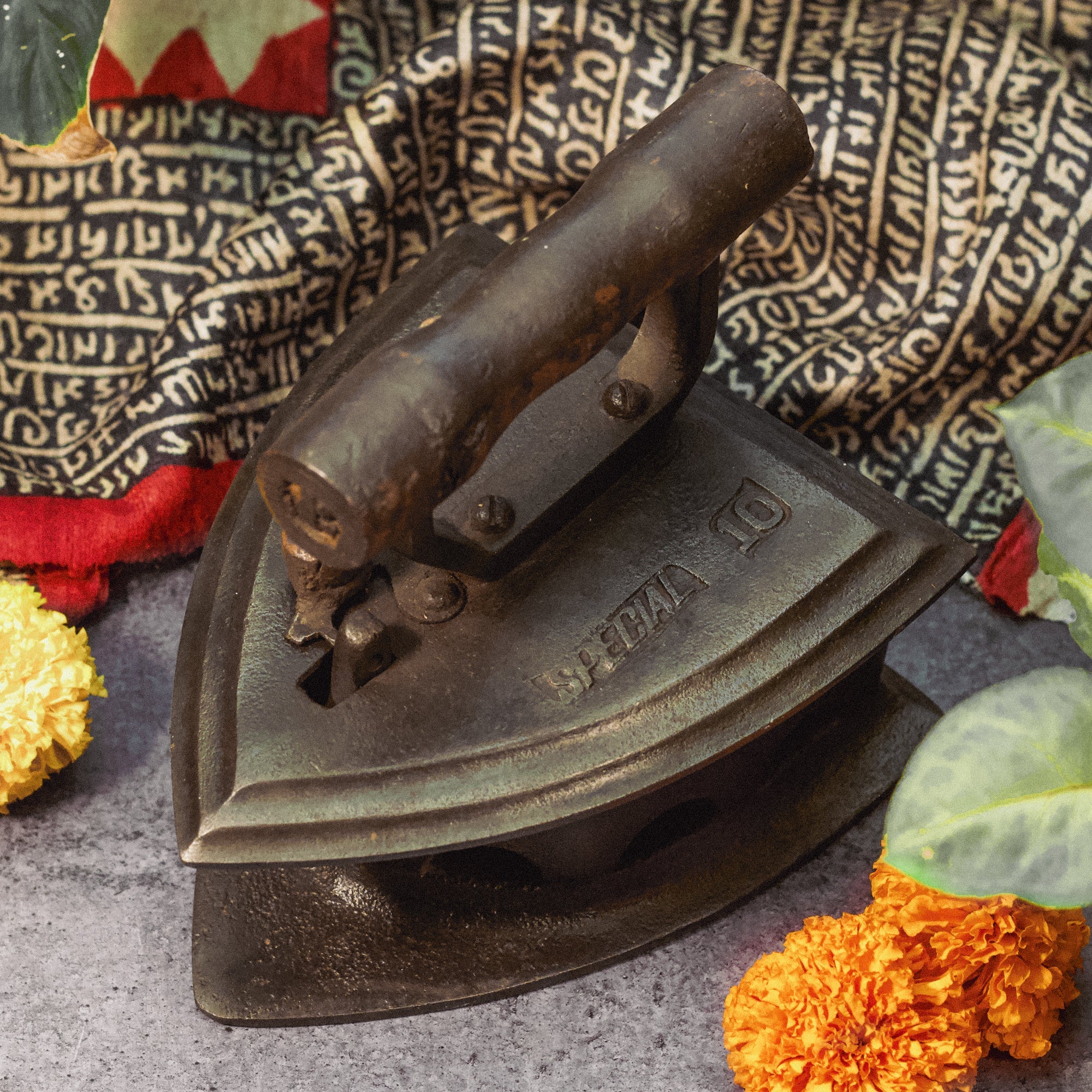 Vintage iron on a textured surface with decorative elements