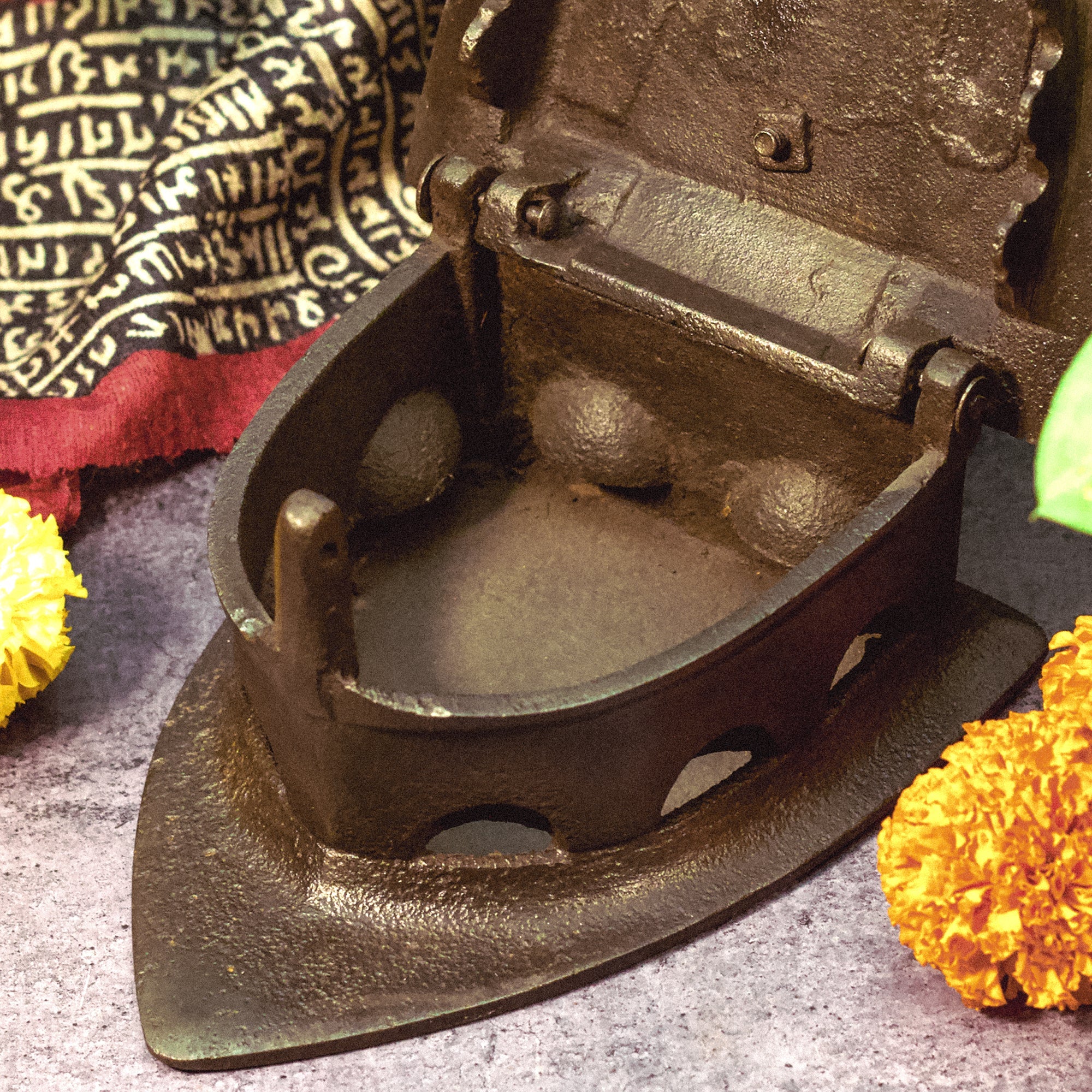 Brass traditional iron on a textured surface with decorative elements
