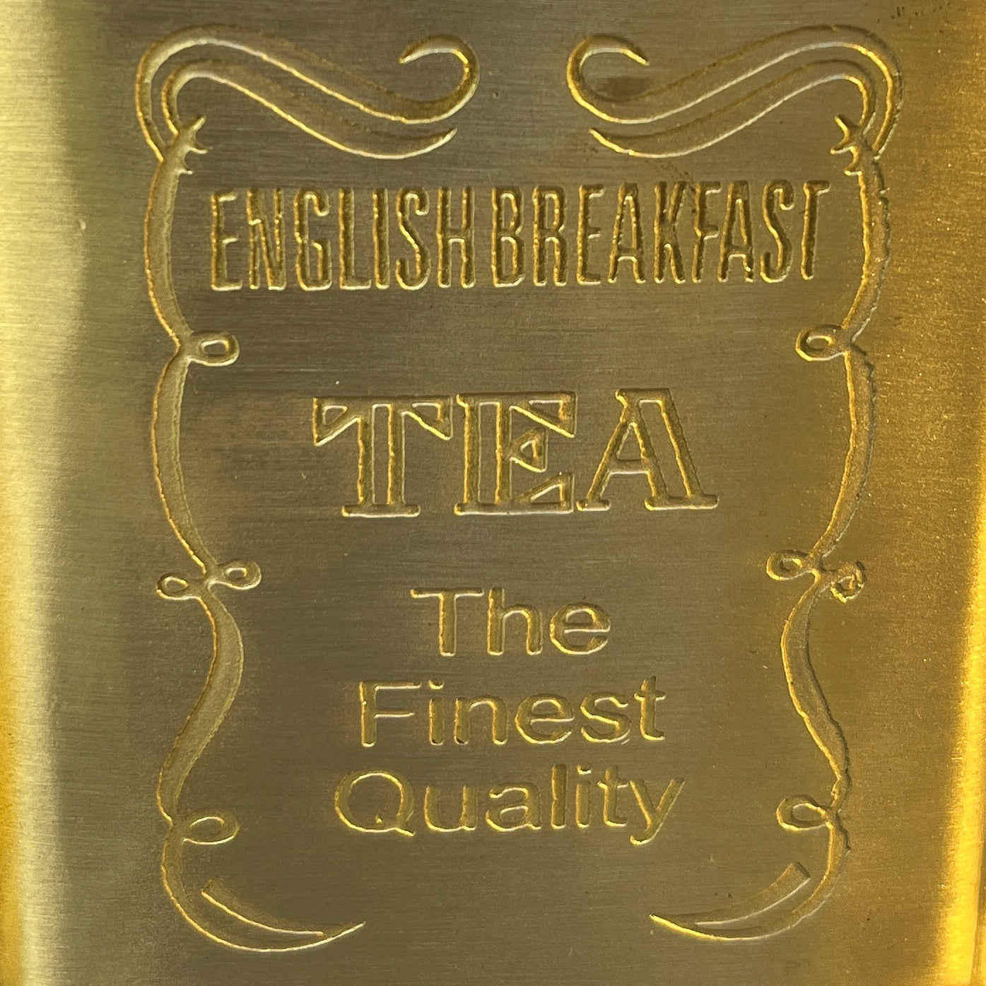 Gold embossed label with 'English Breakfast Tea' text on a gold background