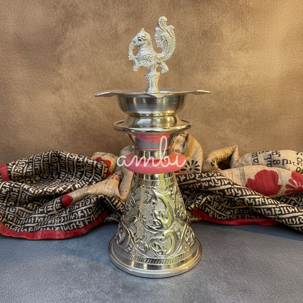 Ambi Silver Plated Peacock Oil Lamp – Decorative Pooja Diya with Ornate Base