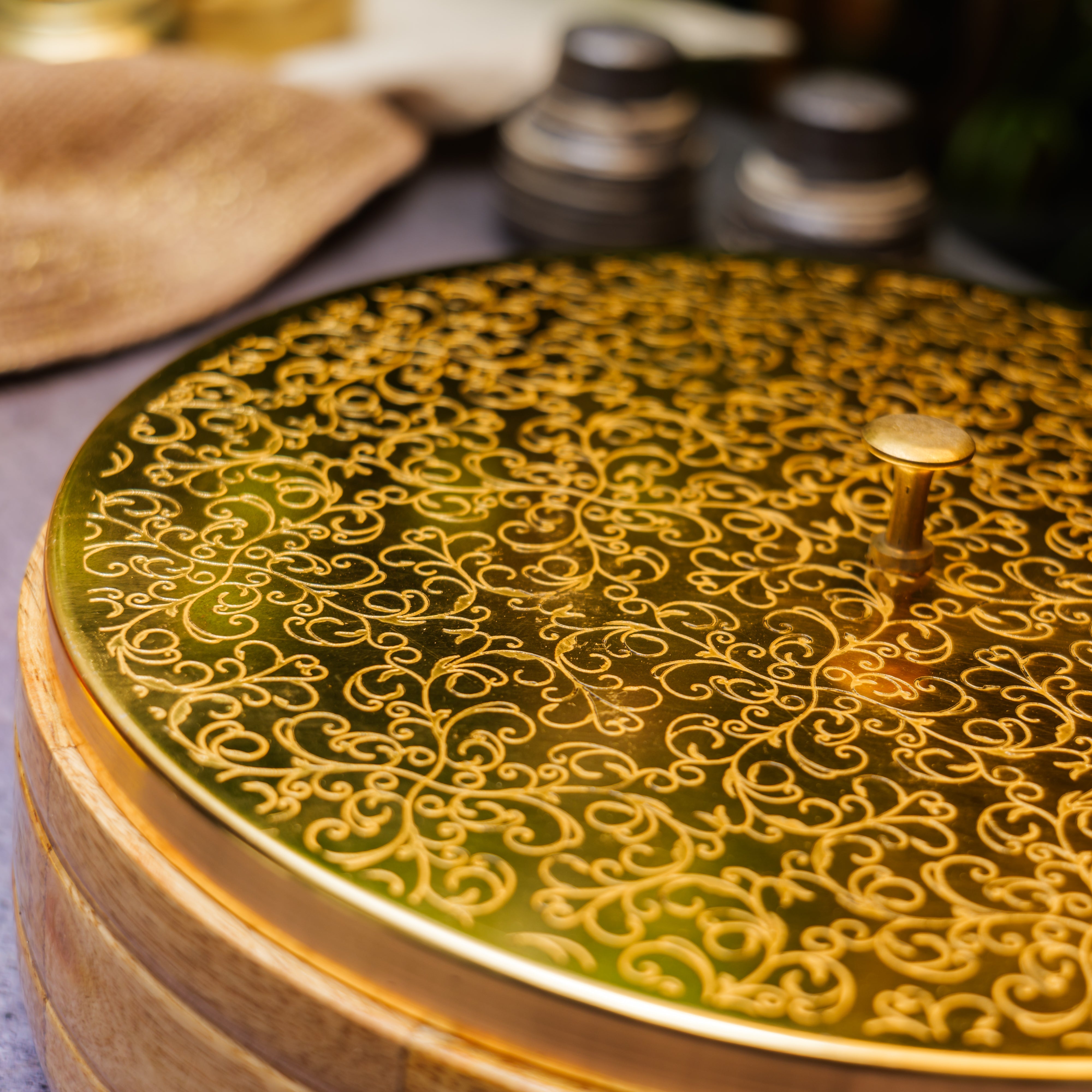 Intricately Etched Ambi Pure Brass Roti Box with Wooden Base and Tongs - 9 Inche