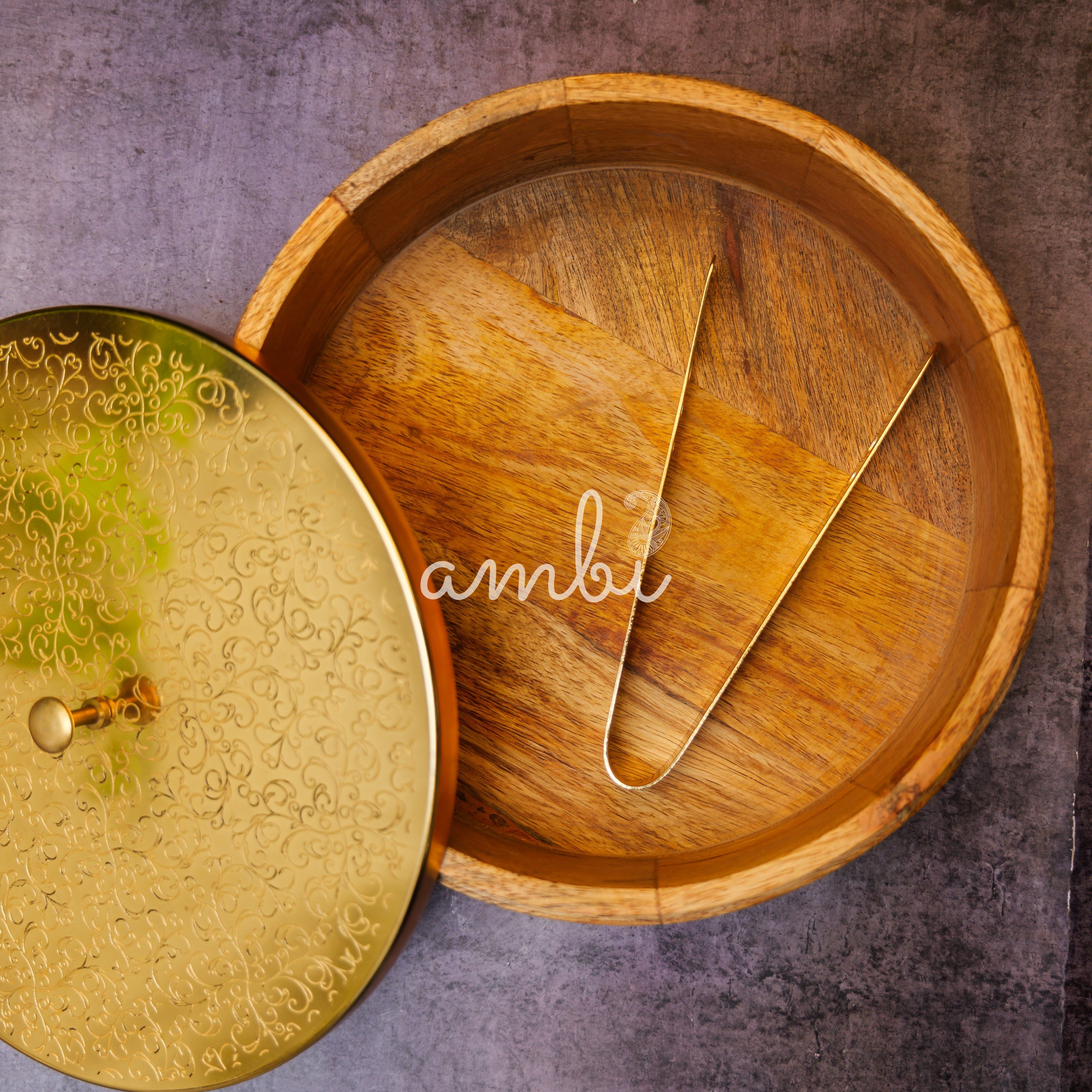 Intricately Etched Ambi Pure Brass Roti Box with Wooden Base and Tongs - 9 Inche