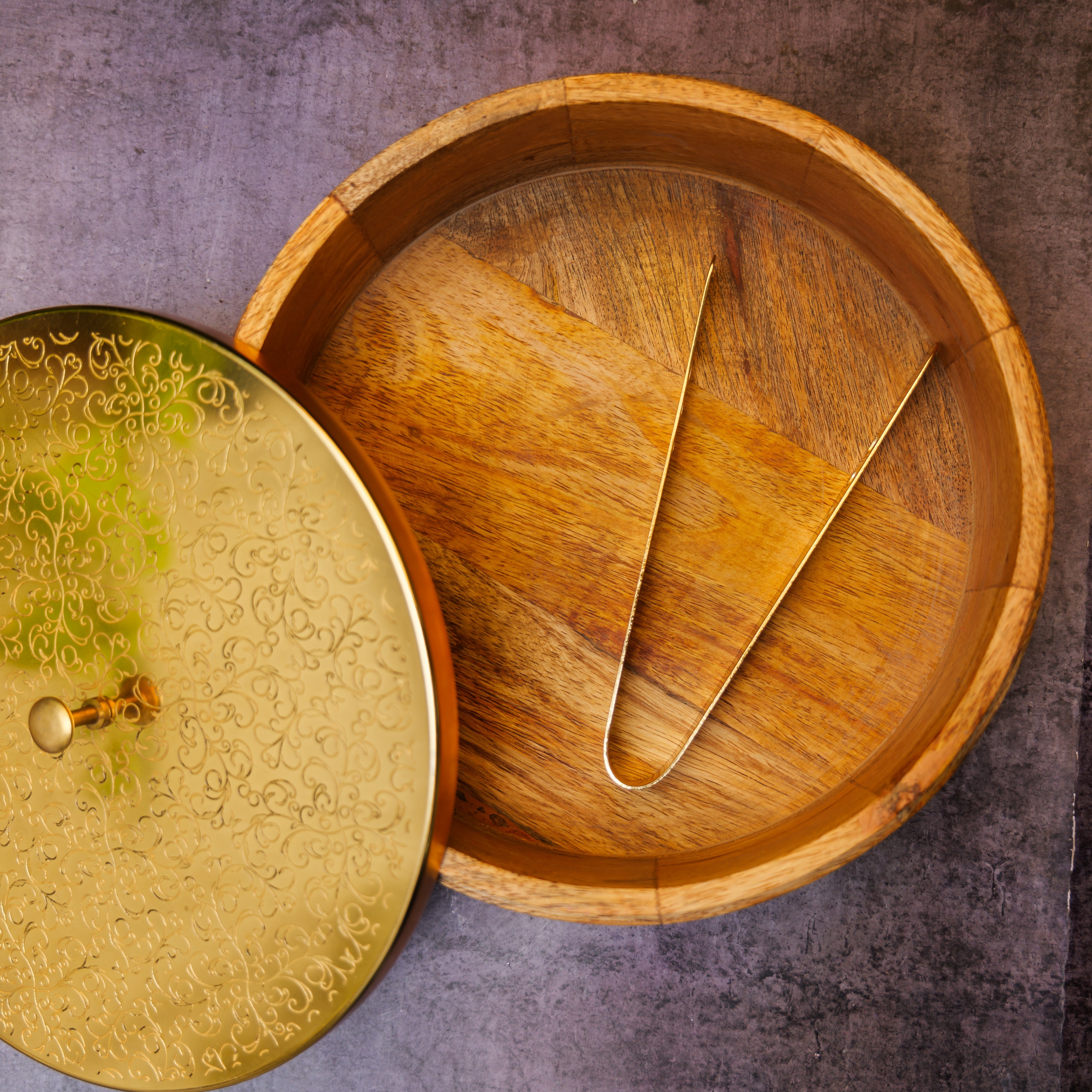 Intricately Etched Ambi Pure Brass Roti Box with Wooden Base and Tongs - 9 Inche