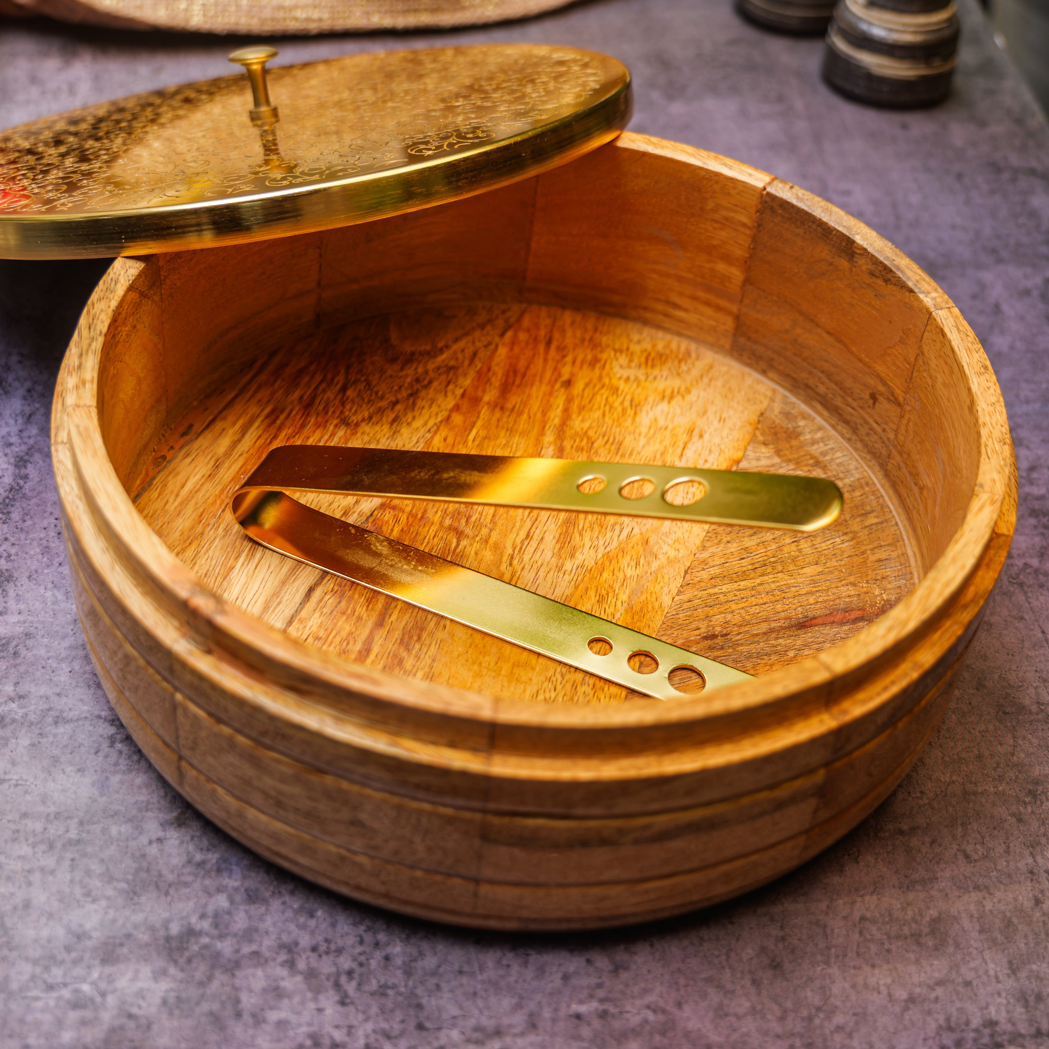 Intricately Etched Ambi Pure Brass Roti Box with Wooden Base and Tongs - 9 Inche