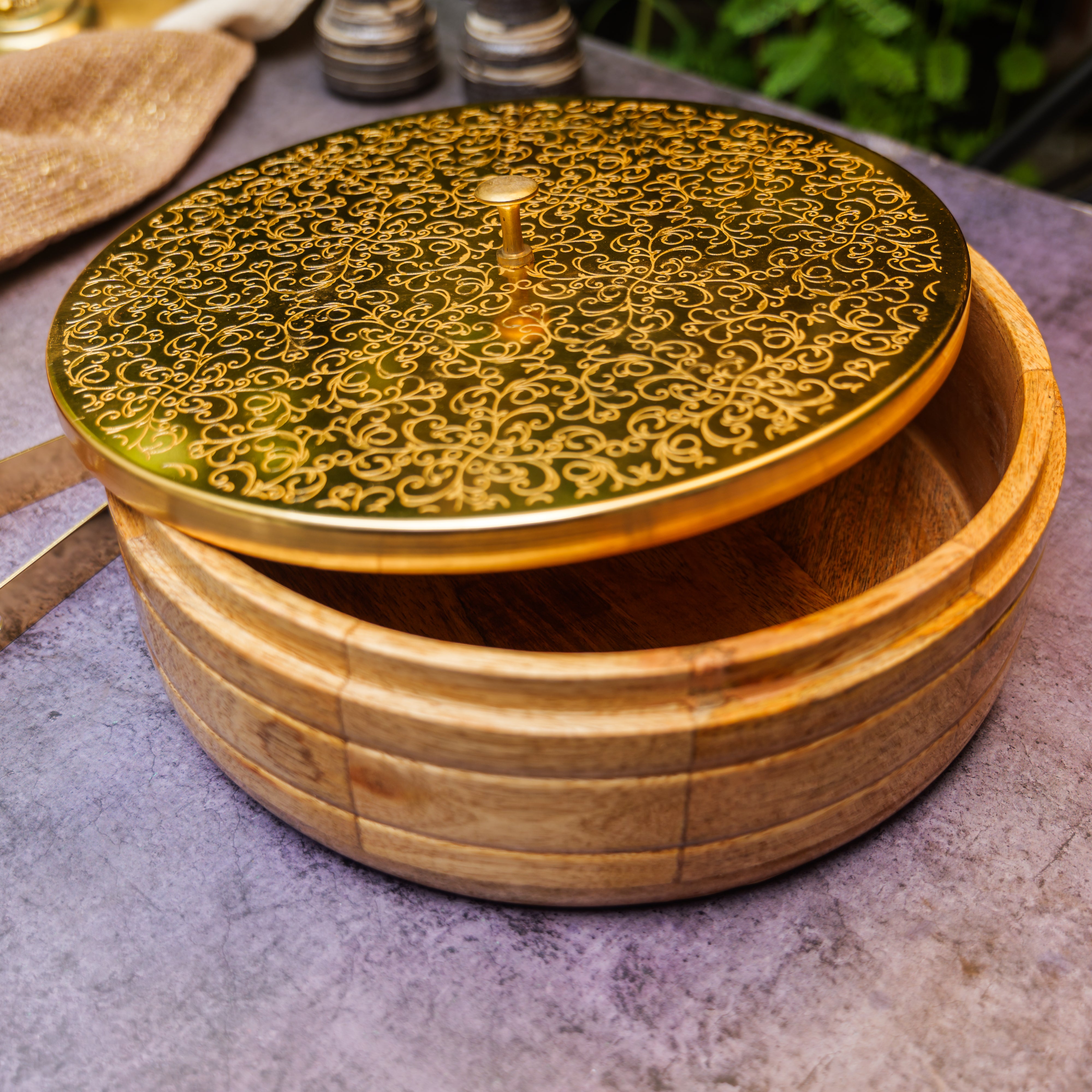 Intricately Etched Ambi Pure Brass Roti Box with Wooden Base and Tongs - 9 Inche