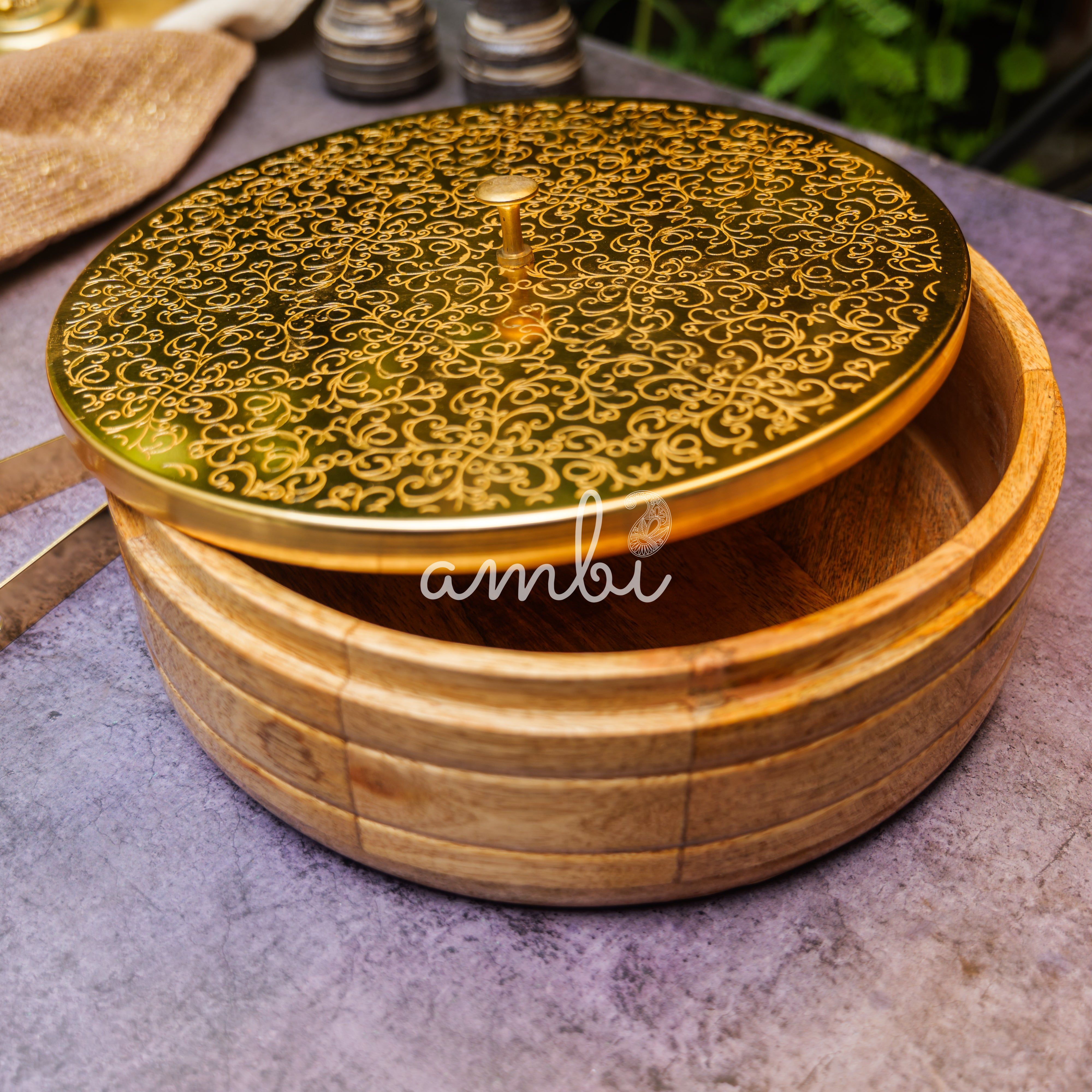 Intricately Etched Ambi Pure Brass Roti Box with Wooden Base and Tongs - 9 Inche