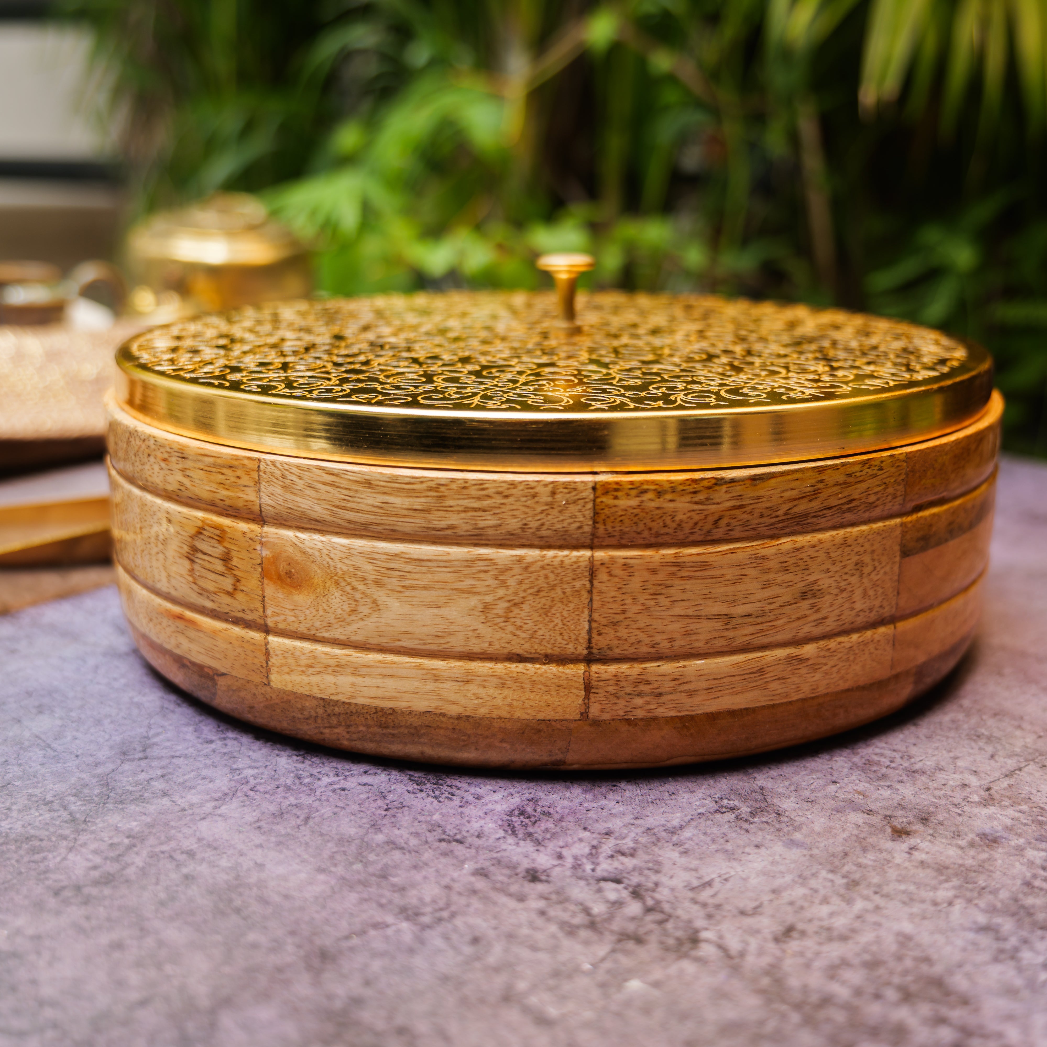 Intricately Etched Ambi Pure Brass Roti Box with Wooden Base and Tongs - 9 Inche