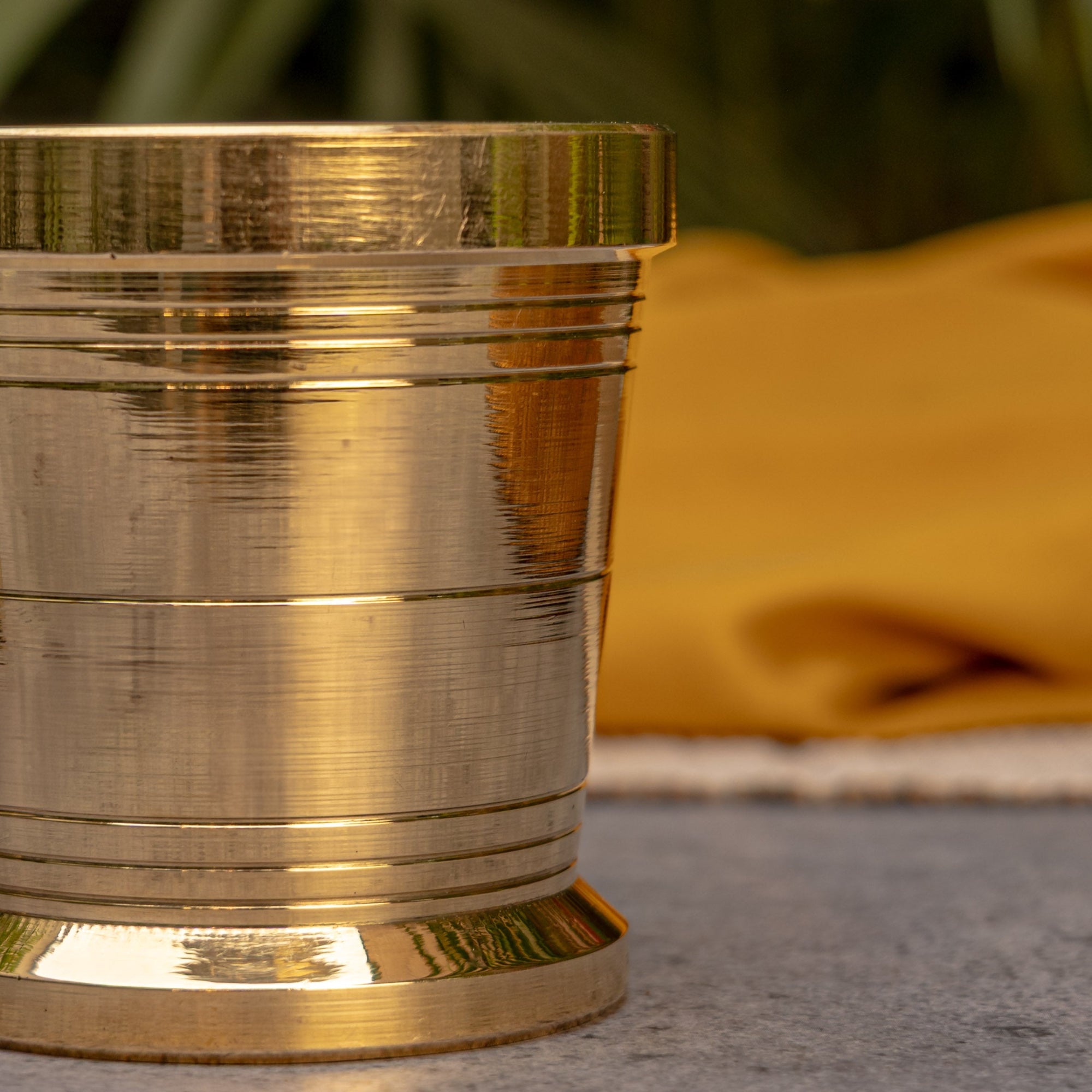 Close-up of a metallic cylindrical object with a blurred background