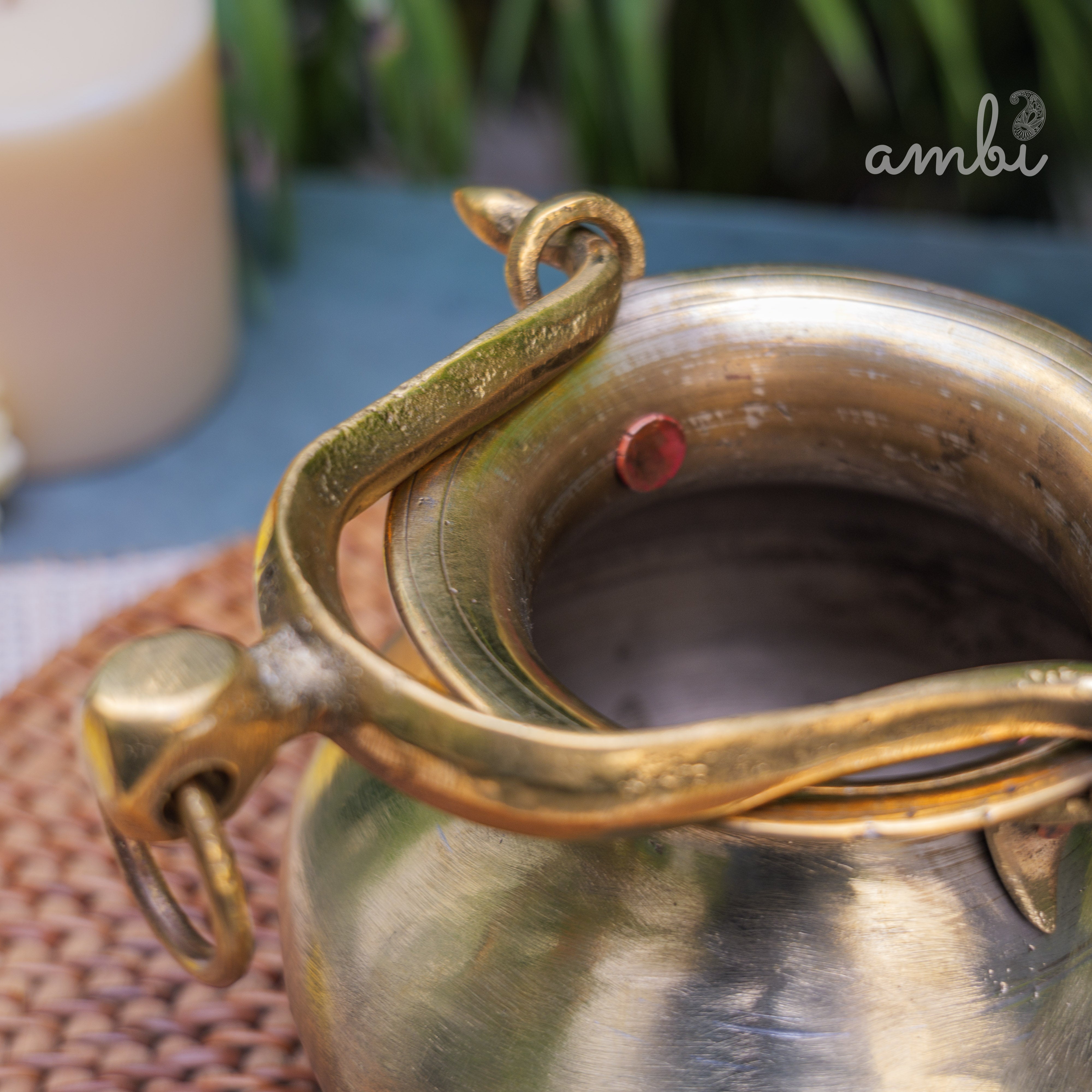 Close-up of a brass instrument with 'Ambi Home' text overlay