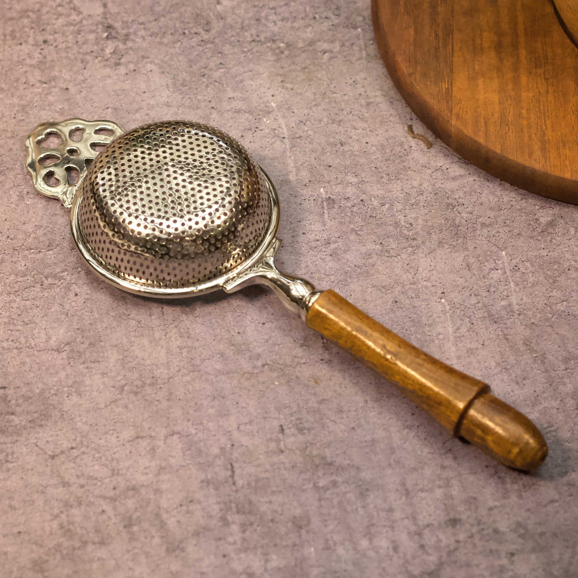 Pure Brass Punched Flower Medium Sized Tea Strainer - Gold Matte Finish With Wooden Handle and Resting pot