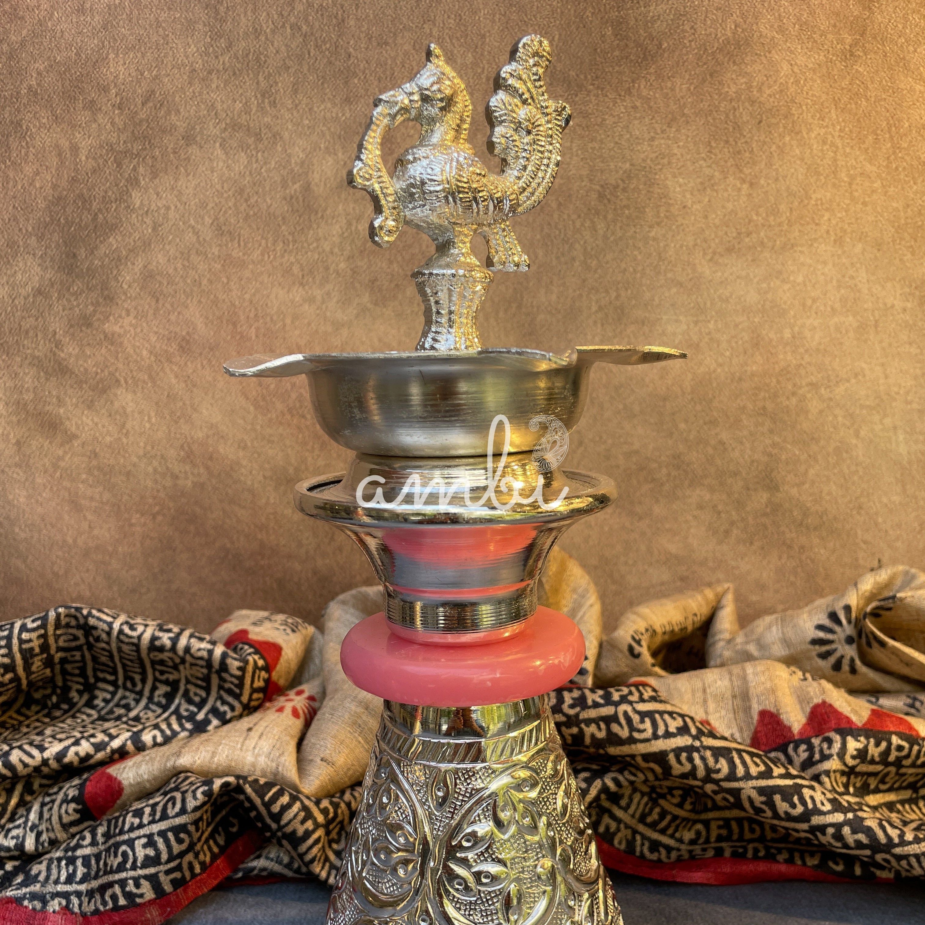 Ambi Silver Plated Peacock Oil Lamp – Decorative Pooja Diya with Ornate Base