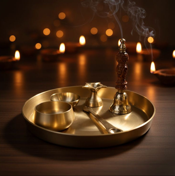 Brass tray with lit candles and incense in a warm, dimly lit setting